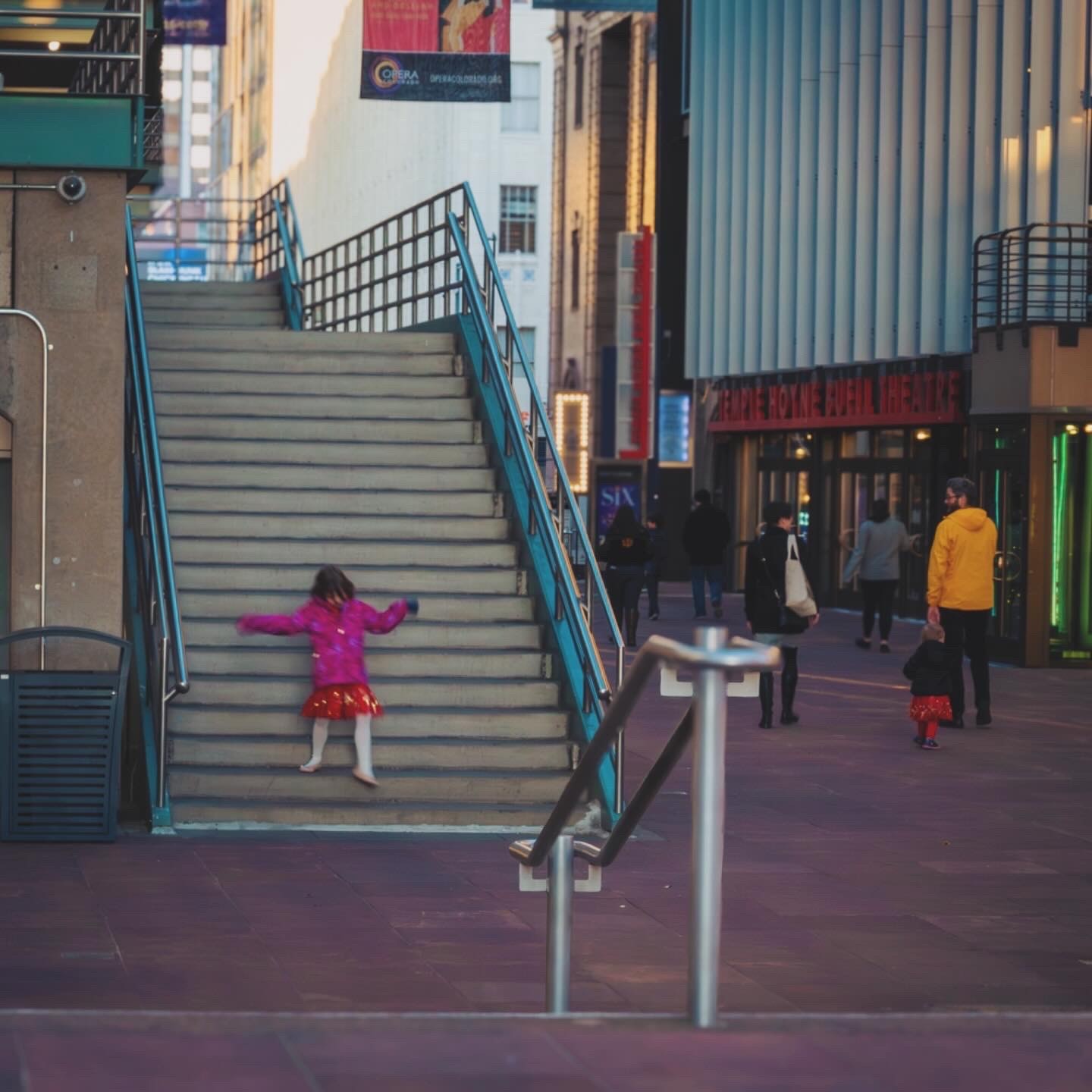 Person sitting on couch working on laptop