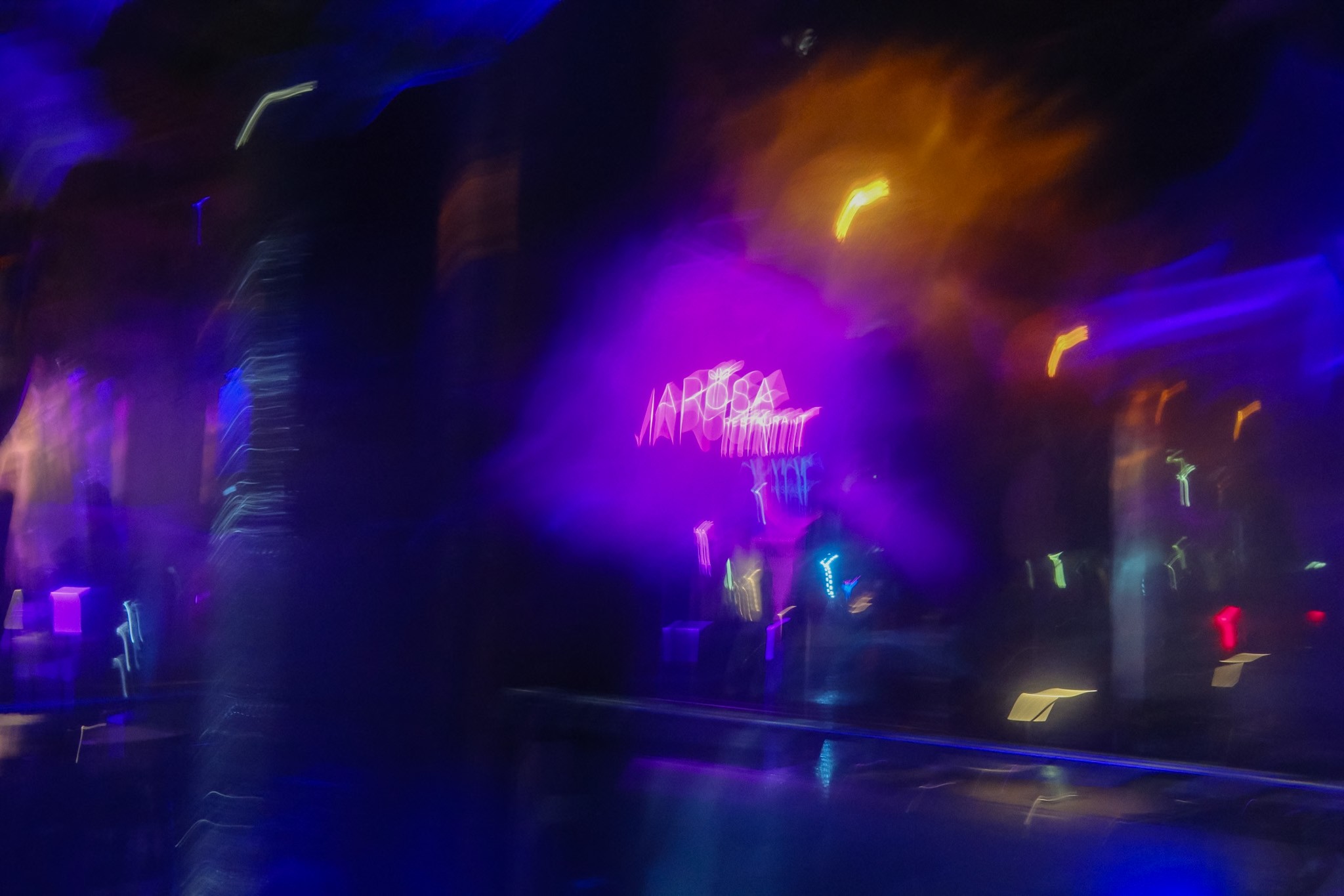 Person at standing desk working on laptop